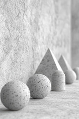 Poster - Minimalist composition with geometric marble shapes, including spheres, cones, and pyramids, arranged against a textured background in grayscale.