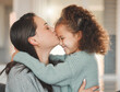© DavisShared/peopleimages.com - Mother, daughter and forehead kiss with affection, love and care in family home, bonding and together. Female person, child and embrace in living room for happiness, connection and positive as parent