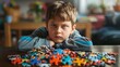 © Brynjar - A boy looks frustrated while surrounded by scattered puzzle pieces, indicating a challenging task.