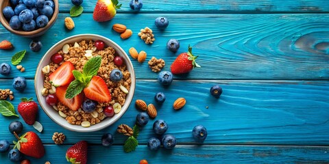 Blue surface with fresh fruit and granola with nuts, healthy breakfast concept