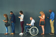 © TamJam/peopleimages.com - Human resources, inclusive and job interview with row of people in studio on gray background for opportunity. Diversity, hiring or recruitment and man with disability in wheelchair for equality