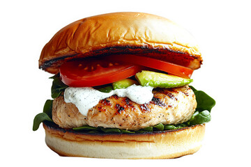 A delicious turkey burger with avocado, tomato, and spinach on a toasted bun.