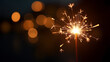 © artmozai - Happy New Year Glittering burning sparkler against blurred bokeh light background