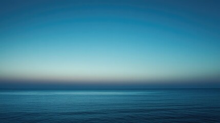 Wall Mural - A tranquil blue sky at twilight, with the last rays of sunlight fading away