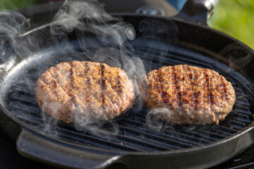 burger meat on grill pan