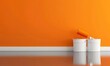 © Moni - Can with paint, brush and renovation equipment on table against orange background