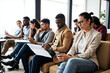 © MOTOKO Stock - Diverse Job Candidates Waiting for Interviews: Modern Office Scene Ideal for HR, Recruitment, and Career Coaching