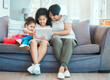 © peopleimages.com - Relax, tablet with smile of granny and kids on sofa together for education, storytelling or streaming. Love, internet or social media browsing with happy family in home living room for study