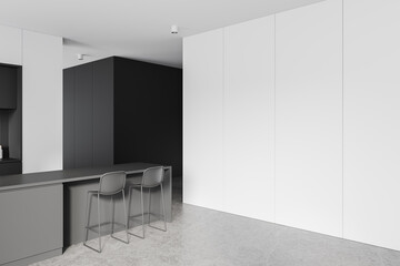 A modern interior featuring a sleek, dark kitchen island with two high chairs. The background includes a blank white wall, ideal for mockups or design templates. 3D Rendering.