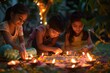 © Татьяна Евдокимова - Three children are carefully lighting diya lamps arranged on the ground, creating a warm glow in the evening during diwali festival
