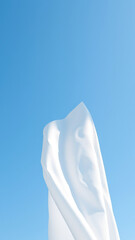 Poster - White fabric against a blue sky