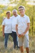 © Serhii - Grandparents walking with they grandson in summer sunset