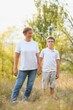 © Serhii - Grandmother and her little grandchild together in sunny summer park