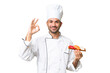 © luismolinero - Young caucasian chef holding a sushi over isolated background showing ok sign with fingers