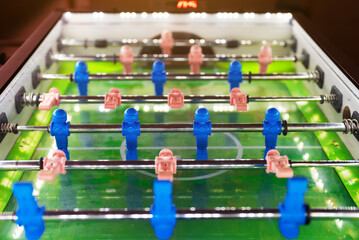 Table football game with white and blue players.