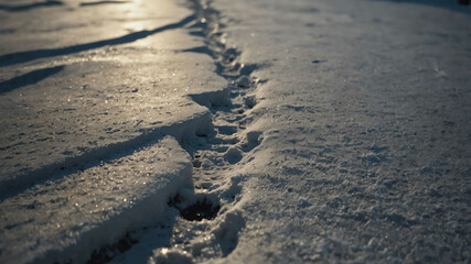 Footprints in the snow winter landscape background