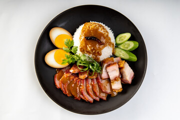 Canvas Print - Barbecued red pork in sauce with rice on a white background, Chinese style roasted pork.