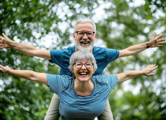 Poster - A happy senior couple having fun, flying like children in the park