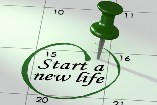 Start a new life word marked on calendar with push pin