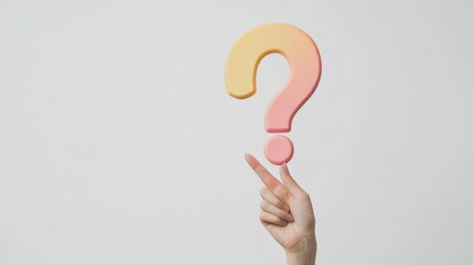 Poster - Finger balancing a pastel-colored foam question mark on a plain background. Image symbolizing inquiry, curiosity, and knowledge.