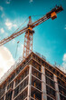 © S photographer - modern building construction site Crane lifting construction equipment