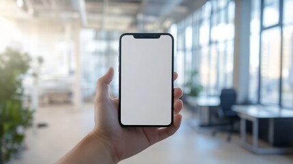Aufkleber - Hand holding a smartphone with a blank screen in a modern, well-lit office. Represents business, technology, and communication