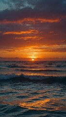 Sticker - A vibrant sunset casting its colors over calm ocean waves.