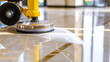 © Luluraschi - close-up of a floor polishing machine in action on a marble floor