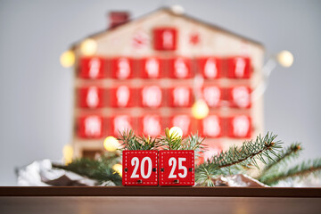 Wall Mural - christmas advent calendar in the shape of a house with boxes making up the number 2025.