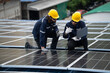 © winnievinzence - Engineer team checking solar cell  or photovoltaic cell by computer laptop installed on the roof of the factory. Technician worker repair or inspect the system. Industrial renewable energy concept