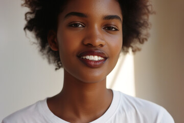 Wall Mural - Portrait of beautiful natural young black woman in white t-shirt