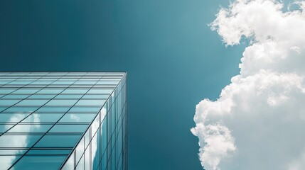 two modern office building and a dark blue sky and white fluffy clouds 