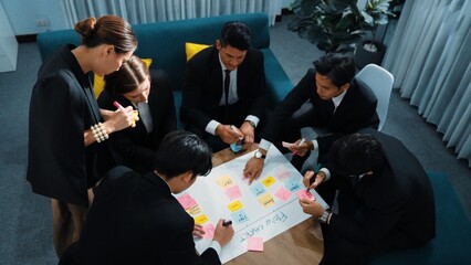 Poster - Top view of business people hands making scrum task board to manage workflow in workplace. Diverse marketing team drawing a line and use colorful stick notes to work on kanban. Close up. Directorate.
