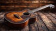 © deafebrisa - Vintage wooden acoustic guitar resting on a rustic floor