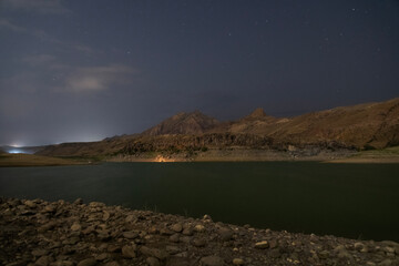 Wall Mural - beautiful night mountains landscape with small lake..