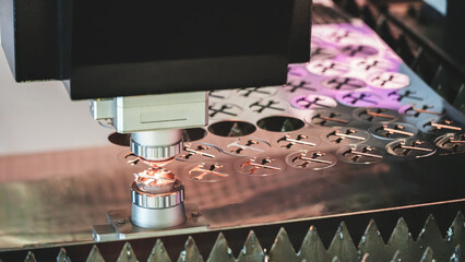 Poster - industrial machine laser cutting metal sheets at work, industrial concept background