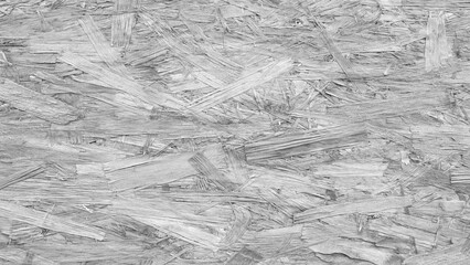 Poster - A pile of wood chips cray color texture background. The pile is made up of small pieces of wood
