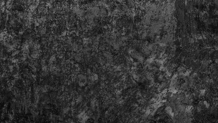 Poster - A black and white photo of a wall with a lot of texture background. The wall appears to be made of concrete and has a rough, uneven surface. The photo has a moody, industrial feel to it