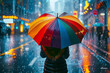 © Vera - Woman with colorful umbrella standing alone in the rain on a busy city street