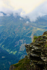 Wall Mural - view of an amazing mountain landscape on a hazy day with gray clouds and fog over the peaks in autum
