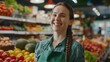 © bvbflo1 - Happy woman in a green apron with a braid at a grocery