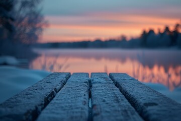 Poster - A wooden bench with a view of a lake and a sunset