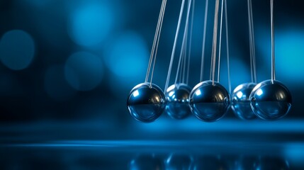 Aufkleber - A stunning depiction of a pendulum set against a captivating blue backdrop. The smooth metallic balls create a beautiful rhythm. Perfect for concepts of motion and physics. AI