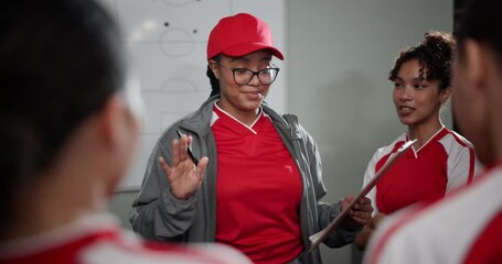 Poster - Woman, coach and clipboard with football team in talk, formation or sport for game strategy in locker room. People, group and soccer player with club manager for advice, info or checklist for contest