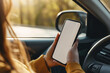 © Максим Коробский - Closeup driver hand is holding smartphone with white screen