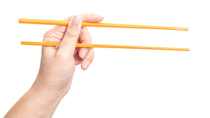 Wall Mural - Female hand holding a orange plastic chopstick isolated on white background.