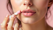 © Lee Design Arts - Woman Applying Pink Lipstick Close-Up Beauty Shot