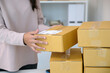 © mangpor2004 - Close up of woman hand, small business owner, packing order at home office