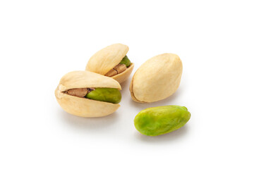 Wall Mural - The pistachios are lying on a white surface. Peeled kernels of nuts. Unpeeled kernels of nuts. Pistachios isolated on white background.