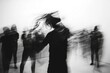 © senyumanmu - Black and White Motion Blur Portrait of Dancing Figure with Blurred Audience in Background
